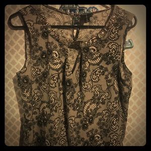 Black & white Worthington top with jewels on neck